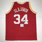 Autographed/Signed Hakeem Olajuwon Houston Red Basketball Jersey Beckett COA