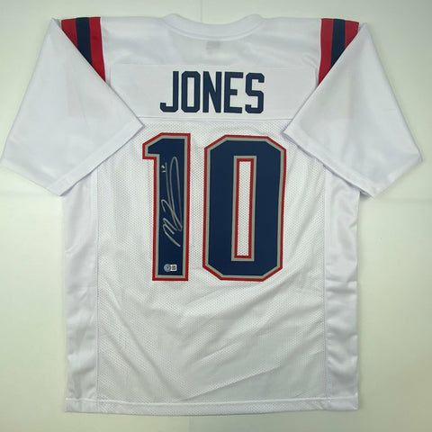 Autographed/Signed Mac Jones New England White Football Jersey Beckett BAS COA