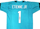 JAGUARS TRAVIS ETIENNE AUTOGRAPHED SIGNED TEAL JERSEY BECKETT WITNESS 220896