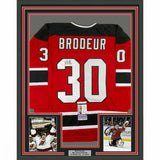 FRAMED Autographed/Signed MARTIN BRODEUR 33x42 New Jersey Red Jersey JSA COA