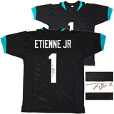 JAGUARS TRAVIS ETIENNE AUTOGRAPHED SIGNED BLACK JERSEY BECKETT WITNESS 220898