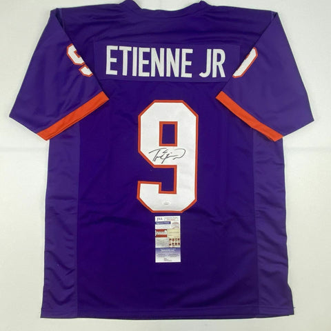 Autographed/Signed TRAVIS ETIENNE Clemson Purple College Football Jersey JSA COA