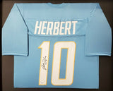 CHARGERS JUSTIN HERBERT AUTOGRAPHED FRAMED POWDER BLUE JERSEY BECKETT 191176