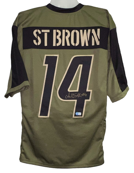 AMON-RA ST BROWN SIGNED DETROIT LIONS #14 SALUTE TO SERVICE JERSEY BECKETT