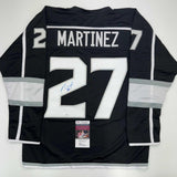 Autographed/Signed Alec Martinez Los Angeles LA Black Hockey Jersey JSA COA