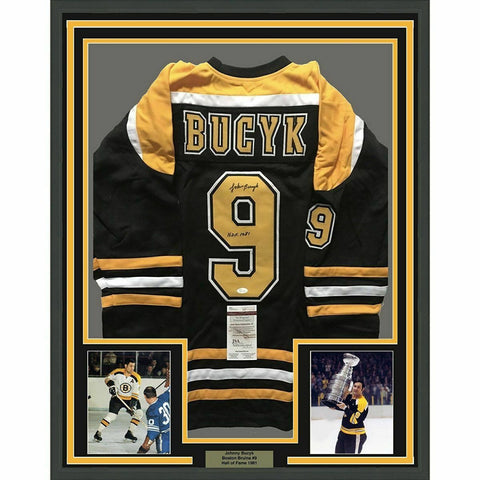 FRAMED Autographed/Signed JOHNNY BUCYK 33x42 Boston Black Hockey Jersey JSA COA