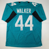 Autographed/Signed Travon Walker Jacksonville Teal Football Jersey Beckett COA