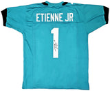 JAGUARS TRAVIS ETIENNE AUTOGRAPHED SIGNED TEAL JERSEY BECKETT WITNESS 220896