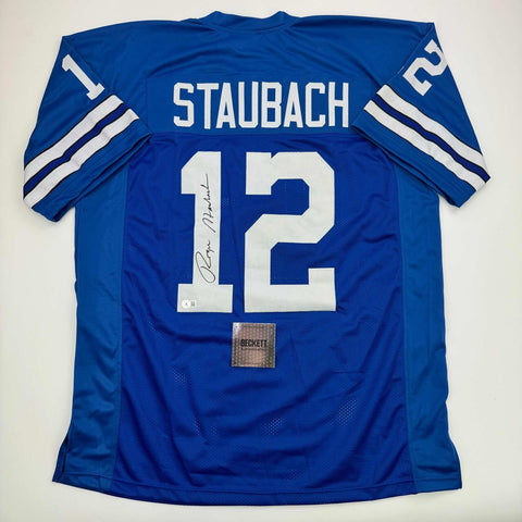 Autographed/Signed Roger Staubach Dallas Blue Football Jersey Beckett BAS COA