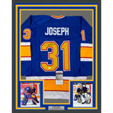 Framed Autographed/Signed Curtis Joseph 33x42 St. Louis Blue Jersey JSA COA