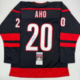 Autographed/Signed Sebastian Aho Carolina Black Hockey Jersey JSA COA