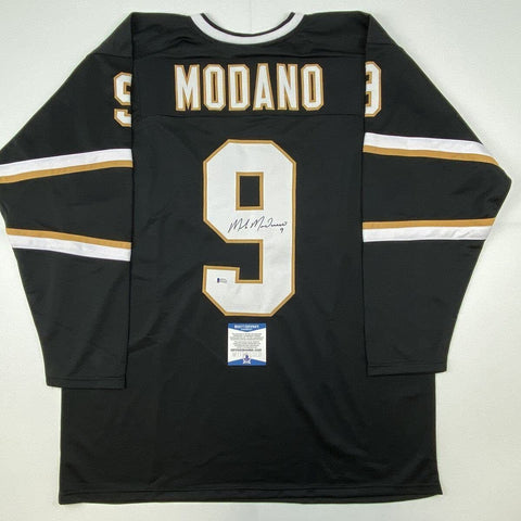 Autographed/Signed Mike Modano Dallas Black Hockey Jersey Beckett BAS COA