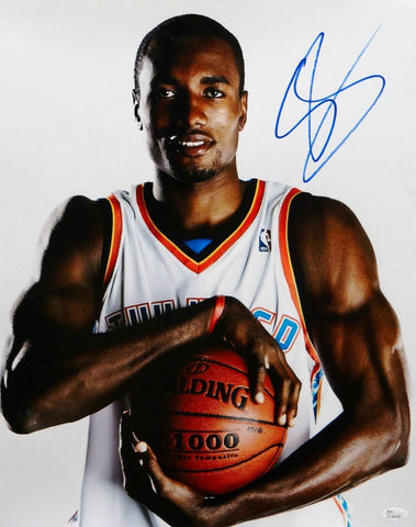 Serge Ibaka Autographed 16x20 Holding Basketball Photo- JSA Authenticated