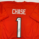 Autographed/Signed Ja'Marr Chase Cincinnati Orange Football Jersey Beckett COA