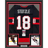 Framed Autographed/Signed Tim Stutzle 35x39 Ottawa Black Hockey Jersey JSA COA