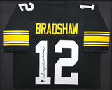 STEELERS TERRY BRADSHAW AUTOGRAPHED FRAMED BLACK JERSEY BECKETT WITNESS 235668