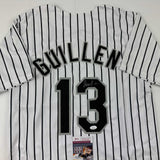 Autographed/Signed Ozzie Guillen Chicago Pinstripe Baseball Jersey JSA COA